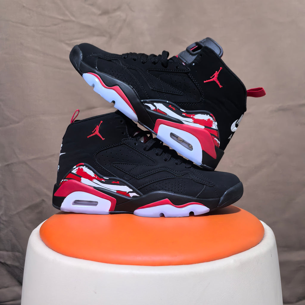 Pair of black high-top sneakers with red and white patterned heel accents