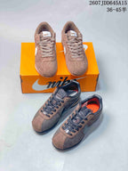 Two photographed brown Nike Classic Cortez colorways shown together, including light brown with white accents and dark brown with black accents.