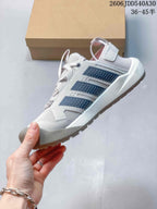 Side view showing the dark stripes and upper of the Adidas Terrex Daroga 25
