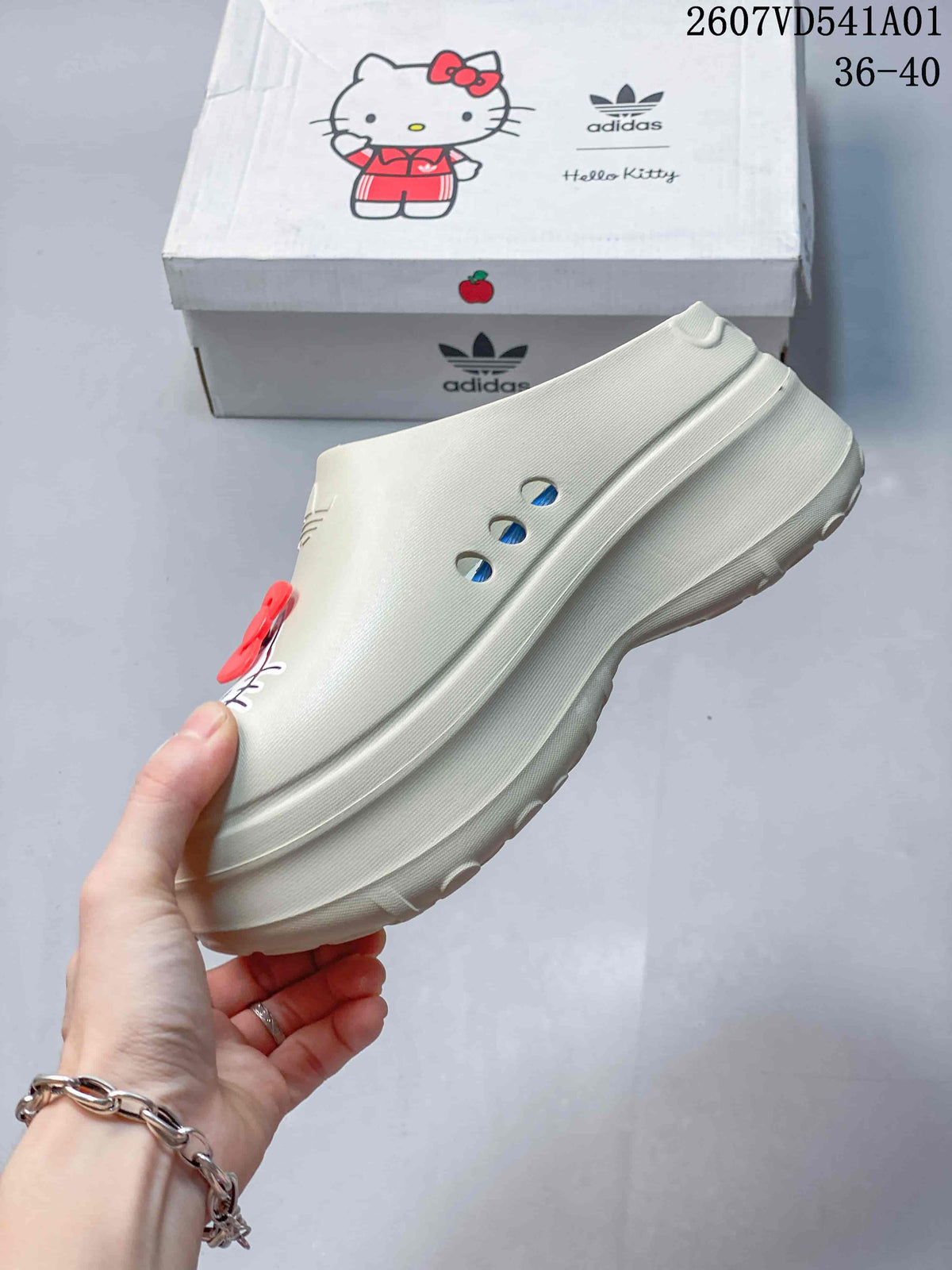 Side view of a cream mule clog showing ventilation holes and a raised sole