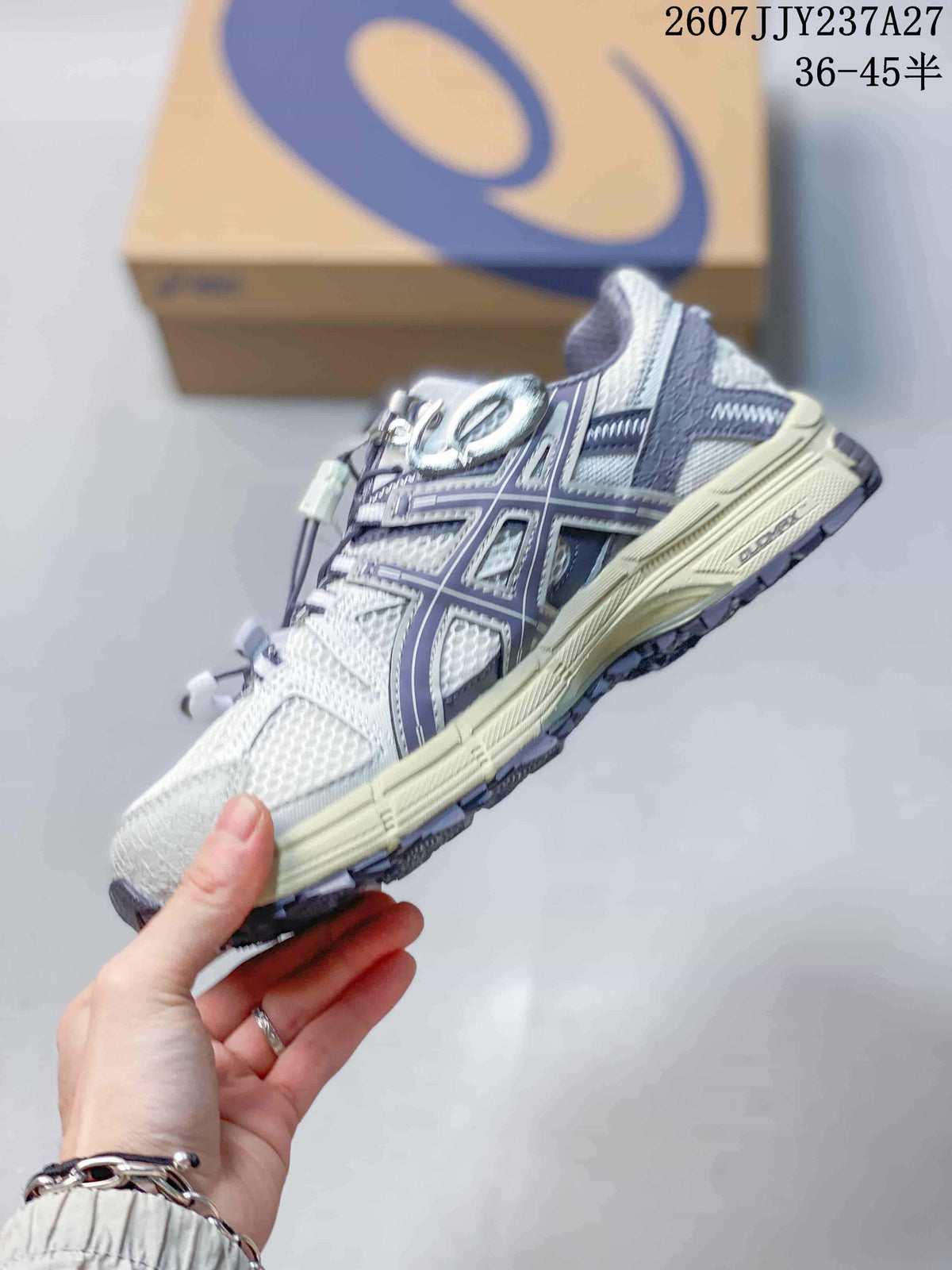 Side profile highlighting the layered ASICS branding, textured upper, and cushioned midsole.
