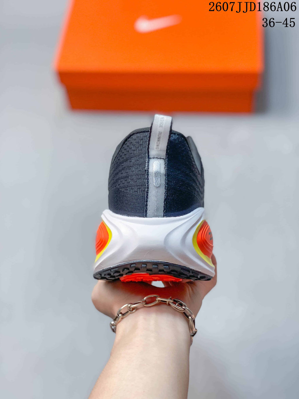 Rear view of the Nike running shoe showing the dark textile heel, pull tab, white heel structure, and colored sole accents.