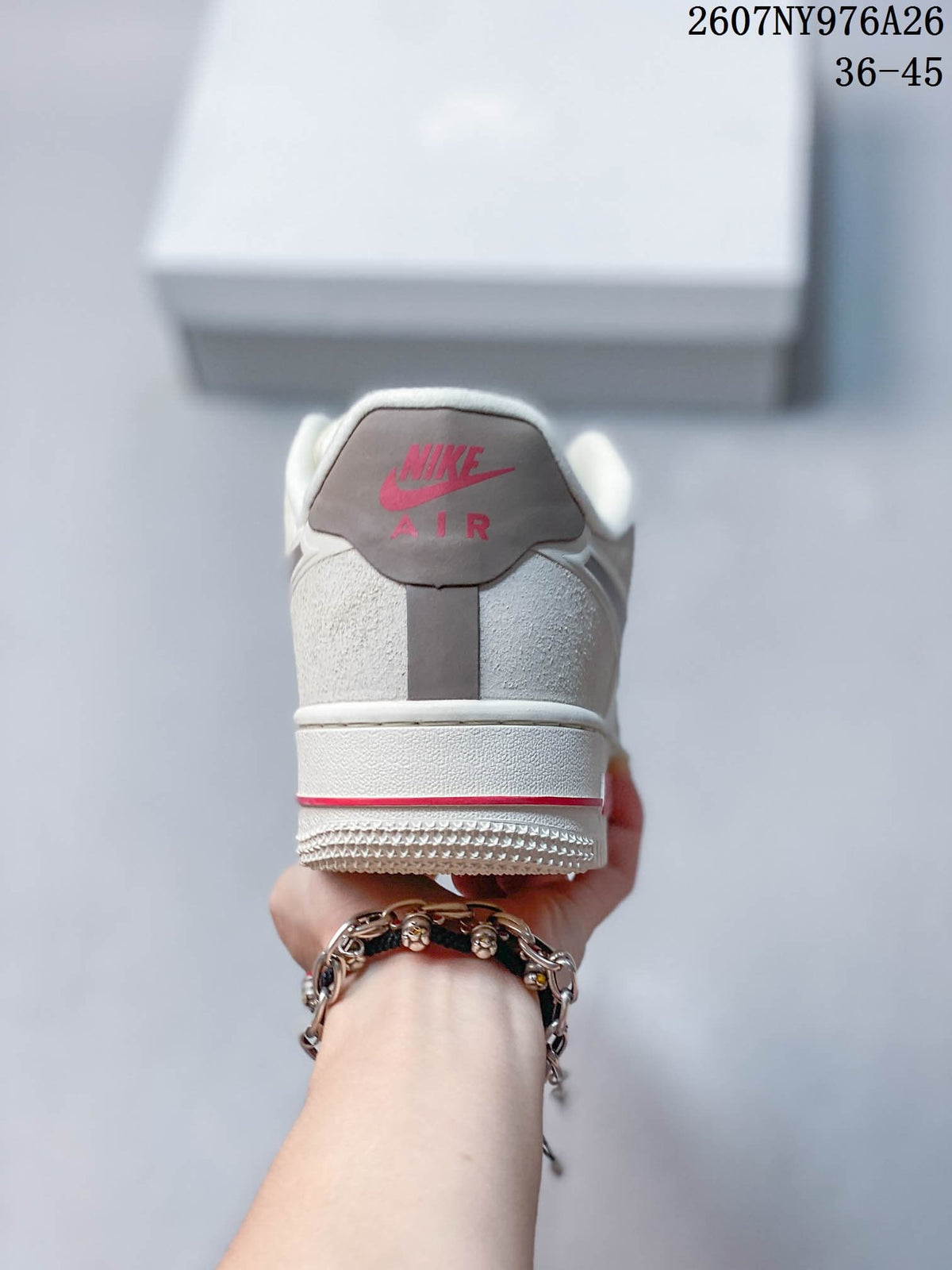 Rear view of the sneaker showing red Nike Air branding and a red outsole accent.