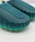 Close-up of the perforated upper panel and small metallic Nike swoosh detail.