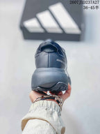 Rear view of the dark gray sneaker showing the heel construction and Adizero Evo SL lettering.