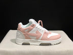 Single side profile of the white and pale pink sneaker against a dark background.