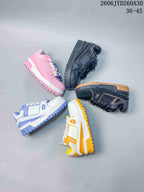 Several Louis Vuitton Trainer Maxi sneakers shown in different color combinations.
