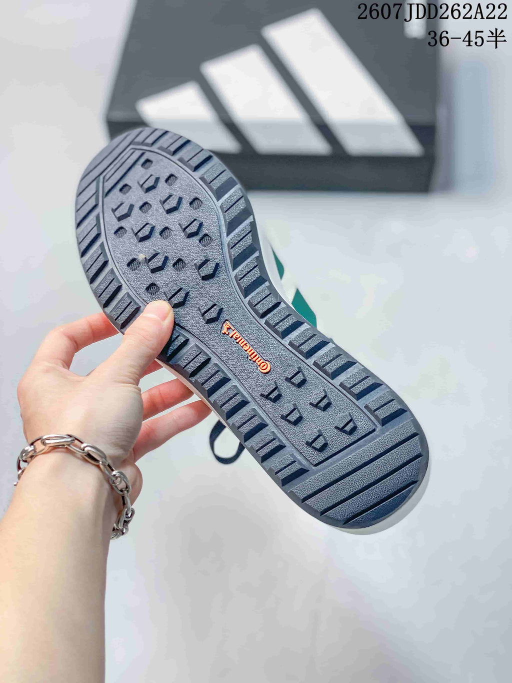 Close-up of the patterned navy outsole with perimeter grooves and visible Continental branding.