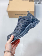 Side profile highlighting the mesh upper, structured overlays, cord lacing system and rugged outsole.