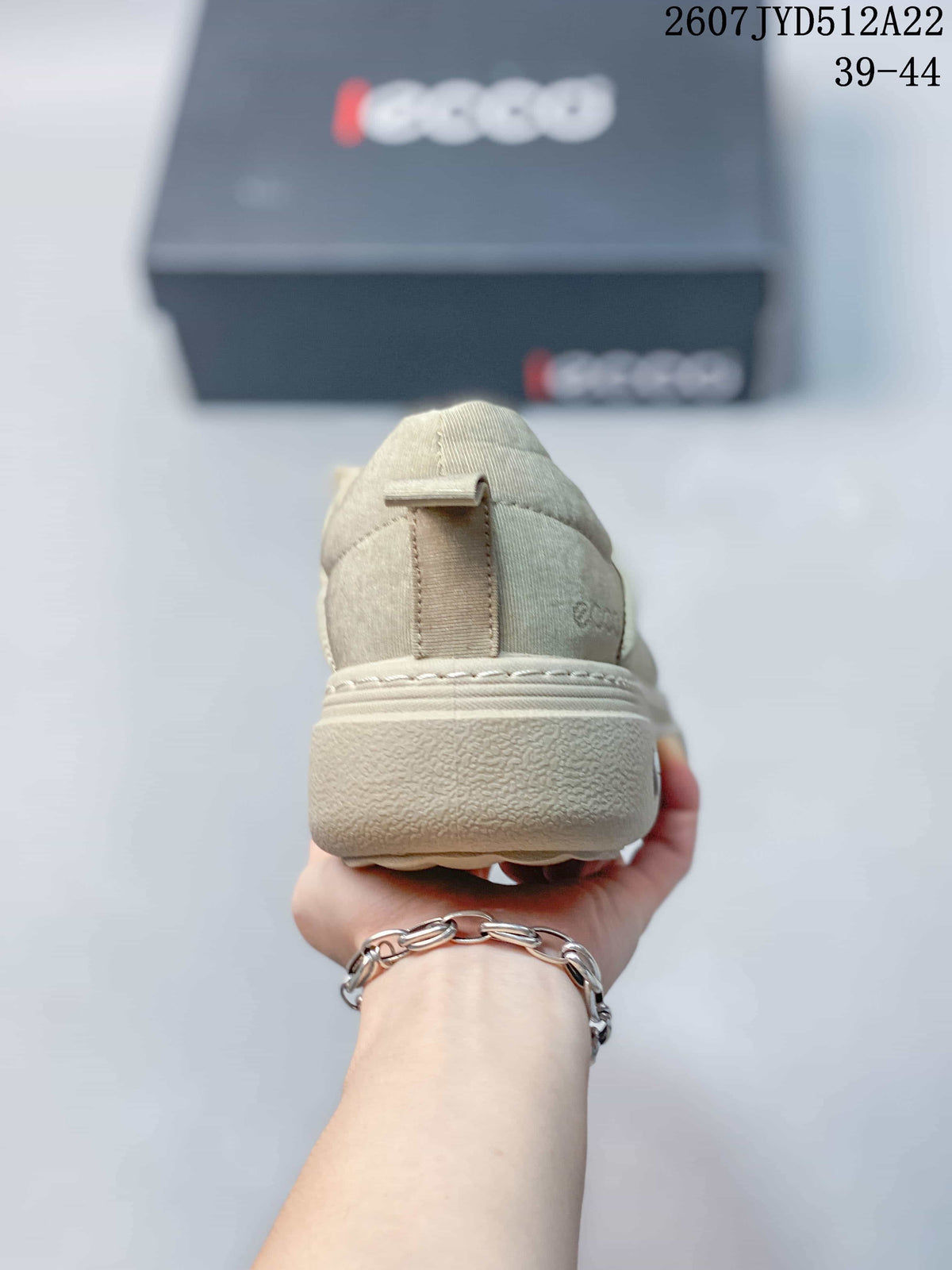 Rear view of a beige ECCO sneaker showing the heel pull tab, padded collar, and layered outsole.