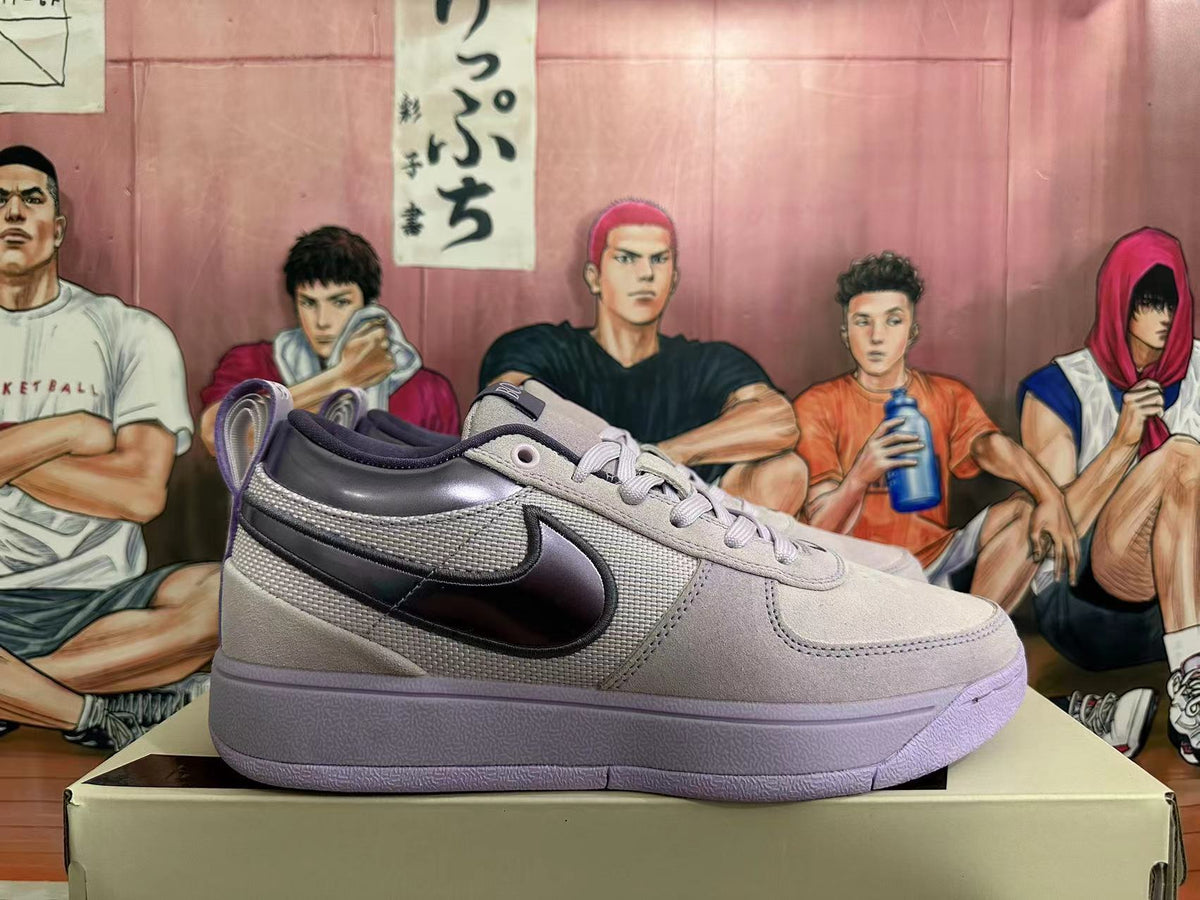 Side view highlighting the textured panels, dark Swoosh, and purple-toned sole.