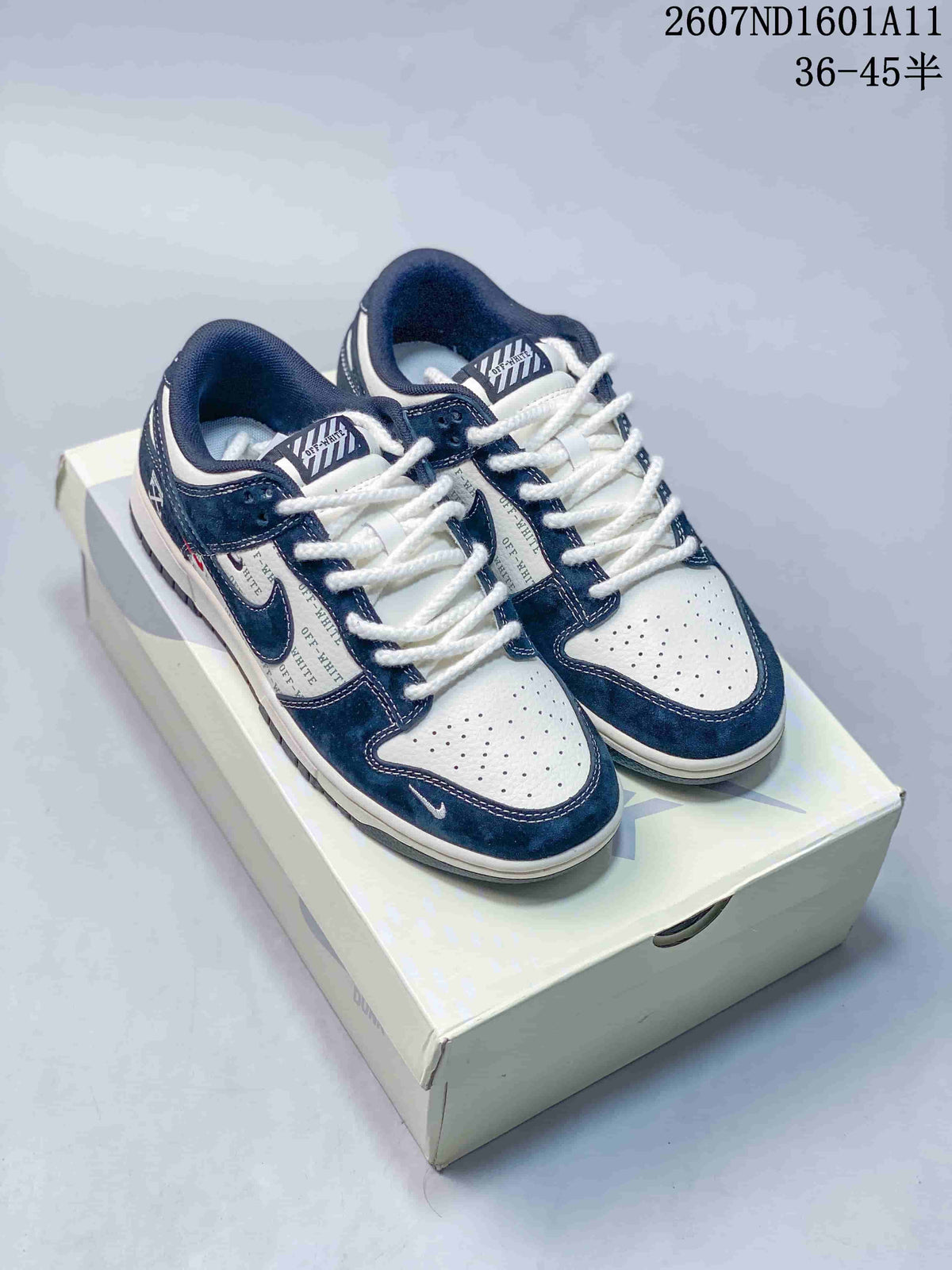 Pair of navy and white low-top sneakers displayed on a shoe box, with the style code and advertised size range visible at the top.