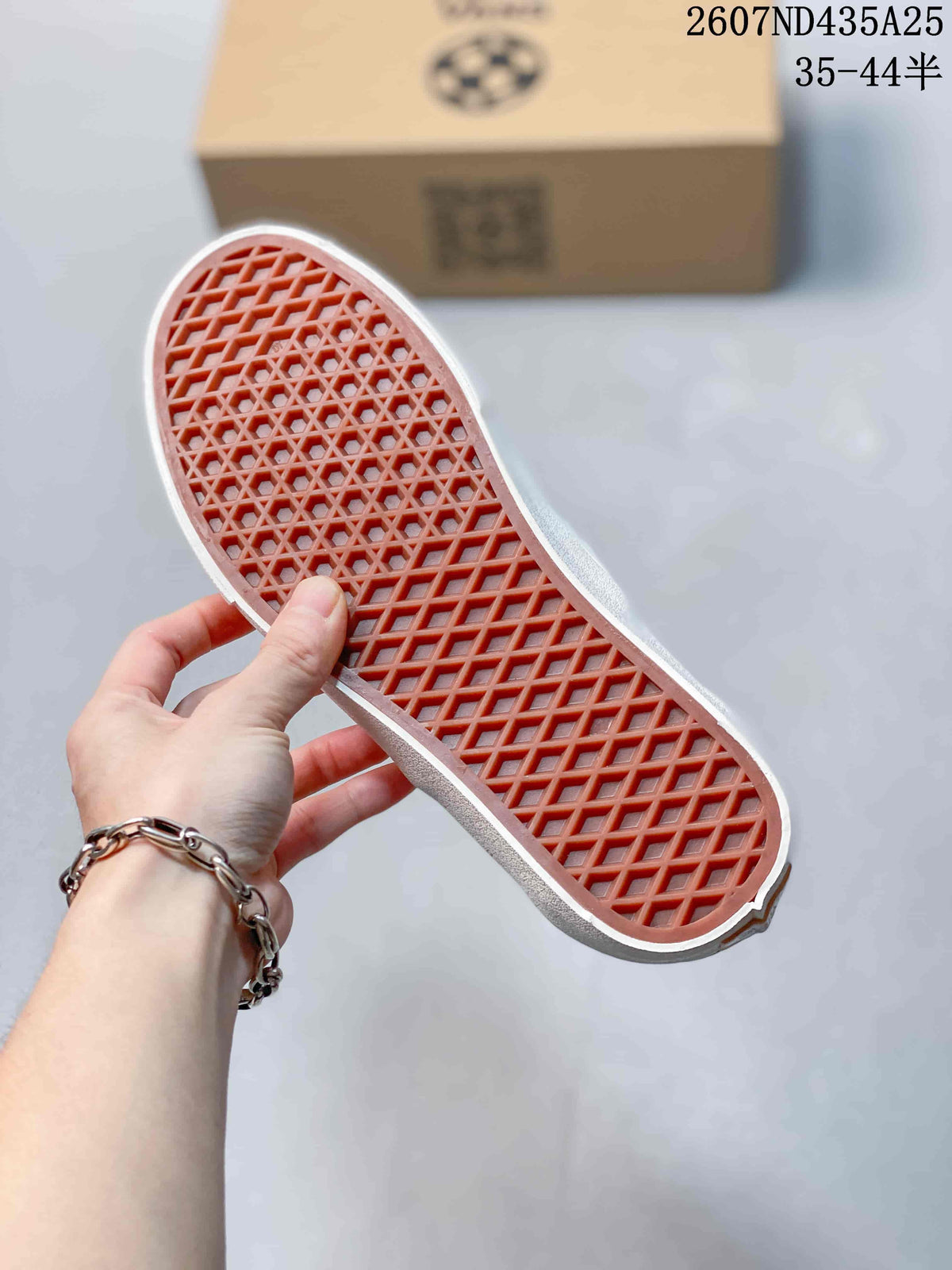Close-up of the white rubber outsole showing its waffle-style tread pattern.