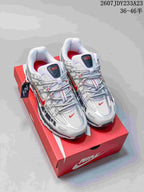 Pair of white, silver, and red Nike P-6000 sneakers displayed on a red shoebox; the image shows style code 2607JDY233A23 and size range 36–46.
