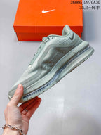 Side profile of a sage-green Nike Pegasus Premium shoe