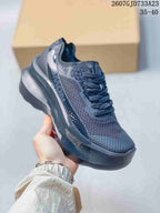 Angled side view showing Salomon branding, textile-look panels, and the raised sole.