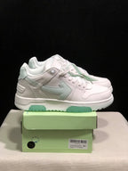 Side view of the white and pale mint sneakers with layered panels, padded collars and a shoebox labeled size 41.