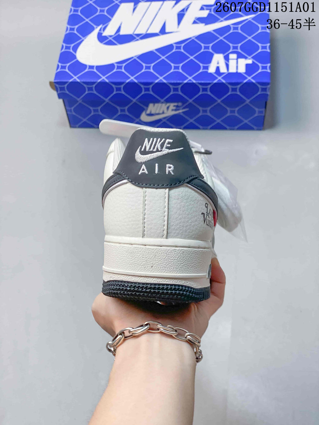 Rear view showing the white heel, dark gray heel tab, and dark outsole.