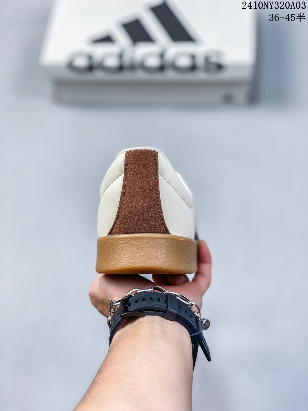 Rear view of the sneaker showing the brown heel detail and gum-colored heel outsole.
