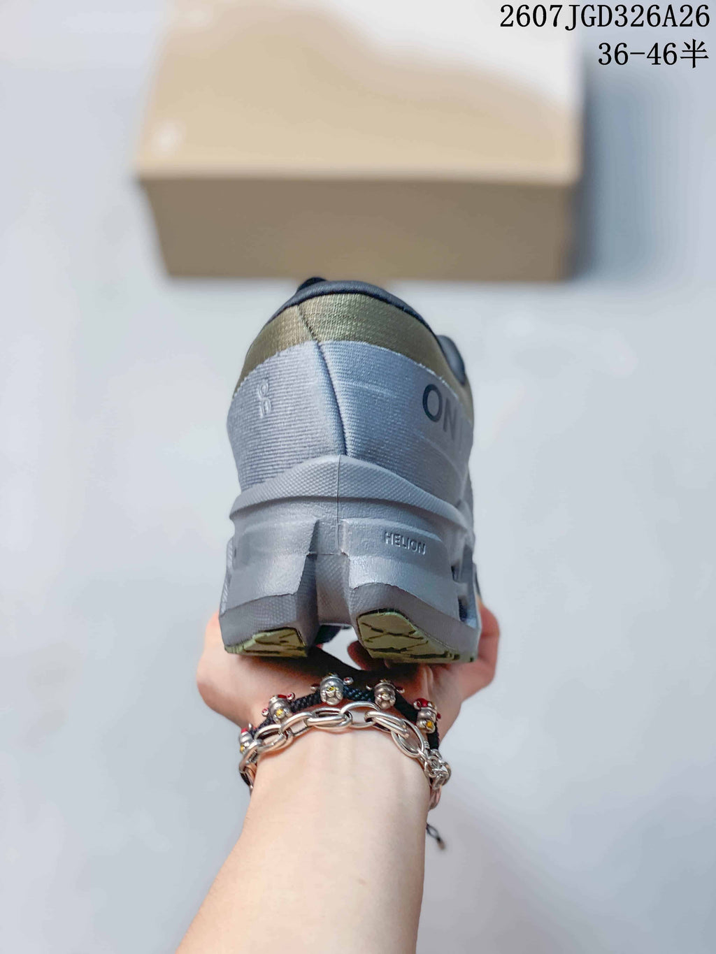 Rear view of the sneaker showing the padded heel structure, gray outsole, and branded heel details.