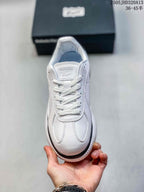 Top-down view of the sneaker showing white laces and stitched panels