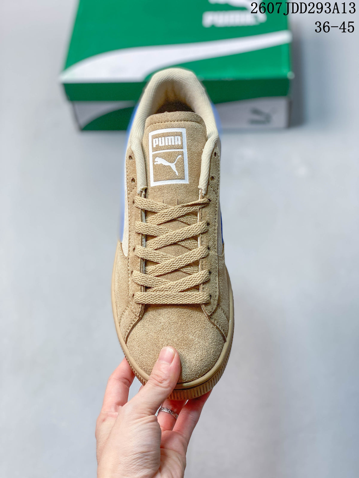 Top view of the tan lace-up sneaker showing the tongue label and textured upper.