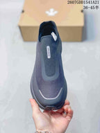 Top view of the sneaker showing the slip-on opening, textured upper, and DESCENTE branding.