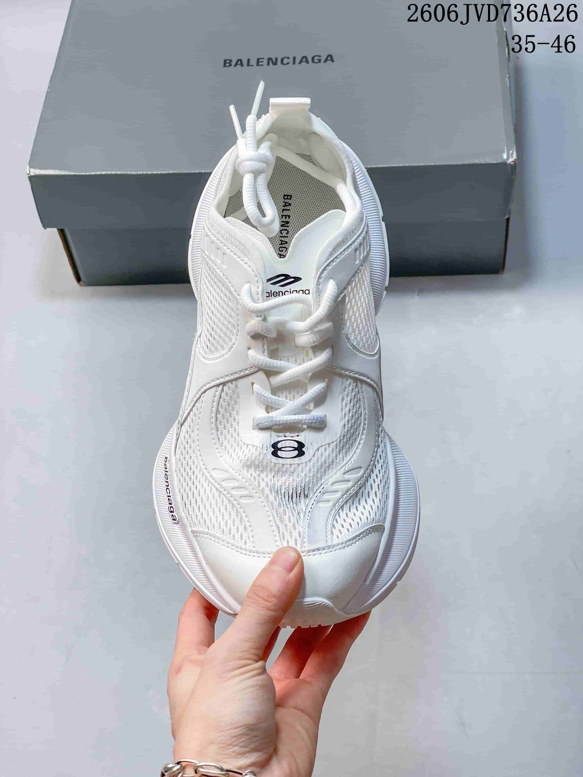 Top view of a white lace-up mesh sneaker with a patterned upper.
