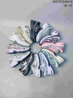 Group image showing New Balance 740 sneakers in multiple color variations arranged in a circle.