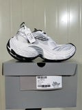 White and black 9110 mesh sneaker displayed on its box, with the box label showing color information, model 9110, and size E 41.
