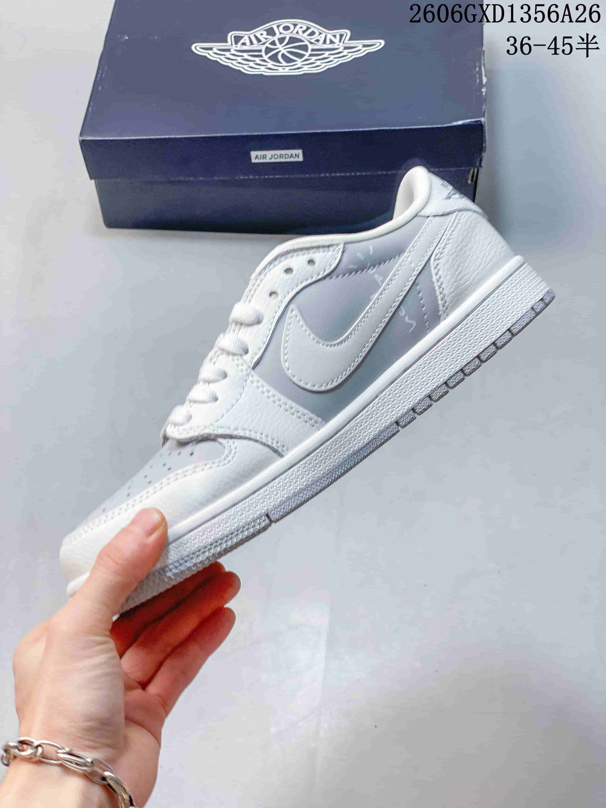 Side view of a white and light-grey low-top sneaker with a swoosh and panel graphics