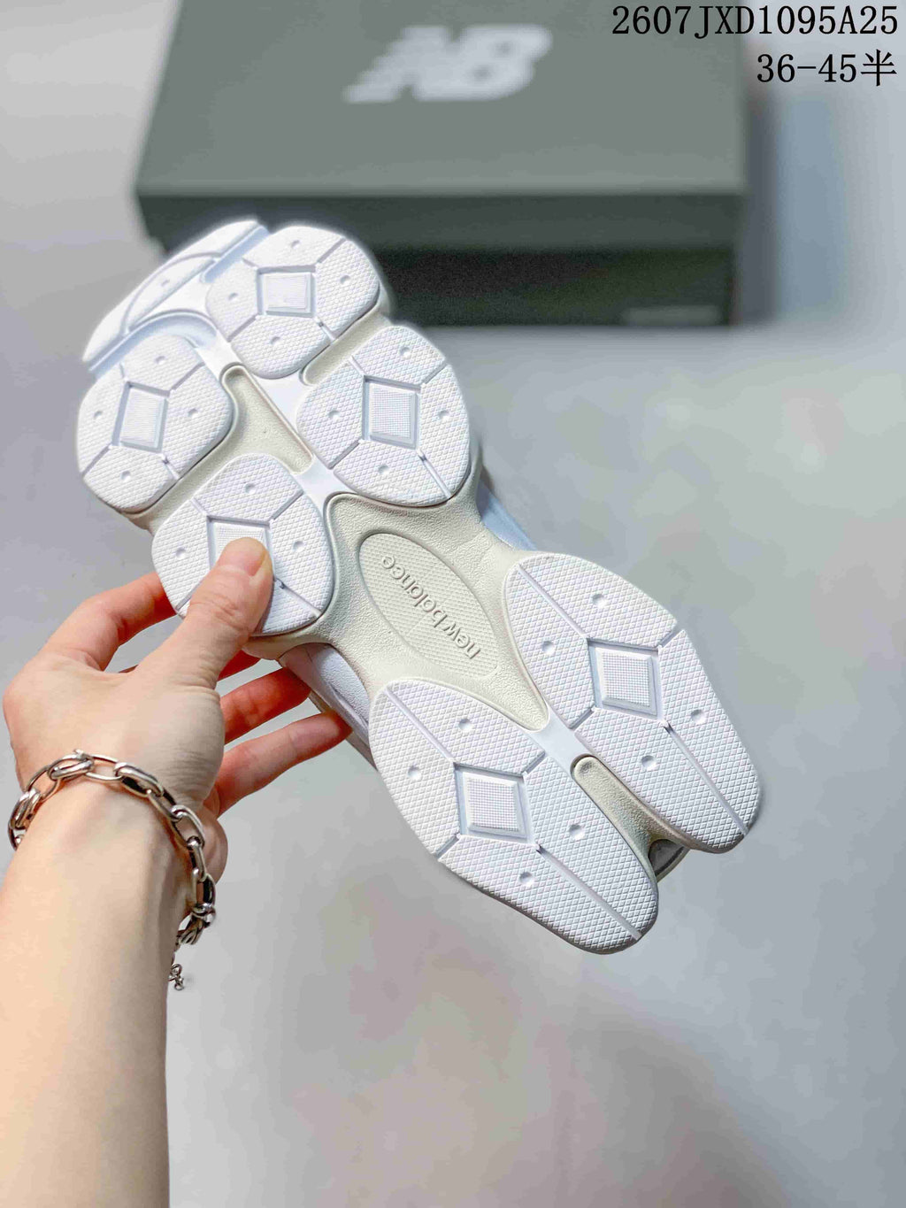 Close view of the segmented white outsole and tread pattern of the sneaker.