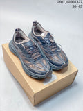 Pair of black and gray HOKA and SATISFY sneakers displayed on a cardboard box, with style code 2607TGD937A27 and size range 36–45 shown above.