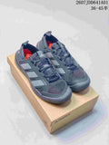Pair of gray Adidas Terrex-style lace-up outdoor sneakers on a box, shown from above at an angle.