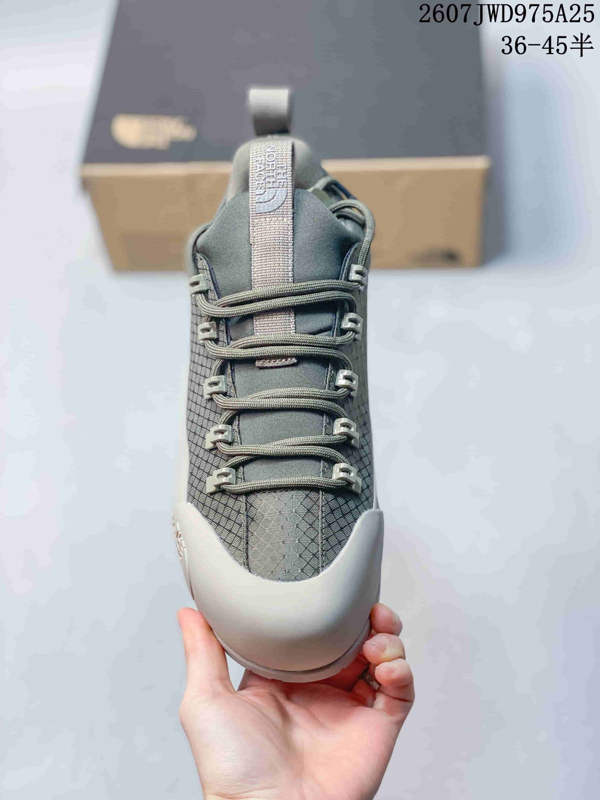 Top view of the gray sneaker showing the tongue, pull tab, laces and textured toe and side panels.