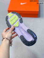 Close view of the sneaker outsole showing black textured rubber sections and lime-green traction areas.