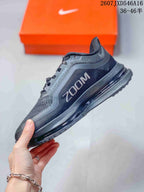 Side profile highlighting the mesh upper, Nike Swoosh, Zoom branding, and layered midsole.
