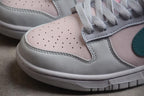 Close-up of the perforated pale pink toe, white overlays and textured laces.