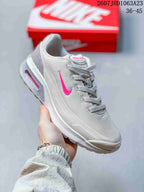 Angled side view of the white and pink Nike Air Max Viva sneaker.