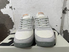 Front view of Nike Book 1 sneakers with gray laces and off-white textured toe panels.