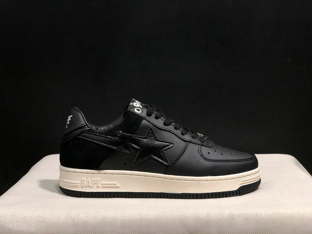 Side profile of the sneaker showing the BAPE-marked midsole and contrasting black and white color scheme.