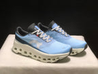 Three-quarter view of the pair highlighting the lace-up construction, side branding, and sculpted white soles.