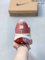 Rear view showing the padded pink heel, pull tab and contrasting outsole.
