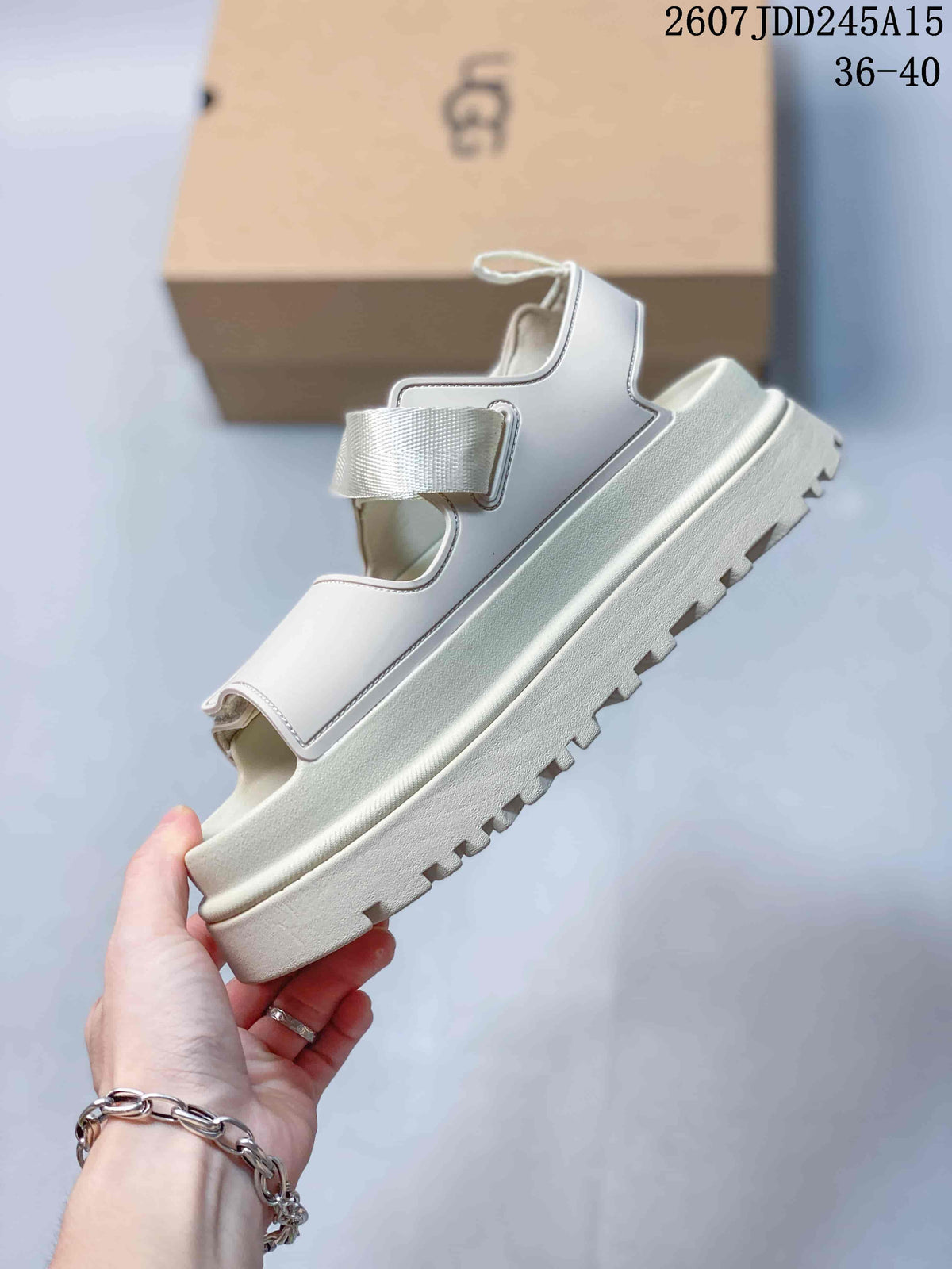 Side view of the light white sandal showing the layered platform midsole and lugged outsole.