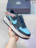 Dark navy and turquoise low-top sneaker with a layered Swoosh and charm detail