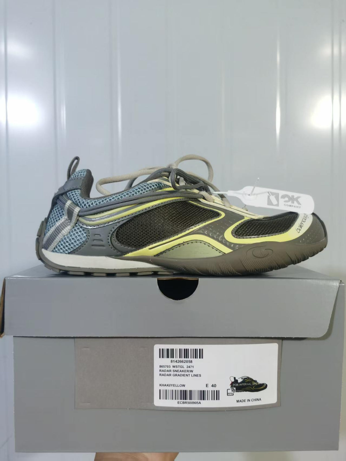 Balenciaga Radar sneaker displayed on its box; the label shows Radar Sneaker W, Khaki/Yellow, and EU 40.