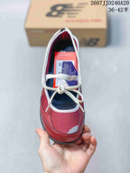 Top view of the red sneaker showing the lace-up closure, white trim, red upper panels, and dark footbed.