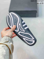 Close view of the patterned outsole with raised tread sections and printed text