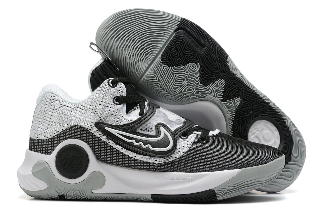 Gray, black, and white Nike KD basketball shoes with a patterned outsole.