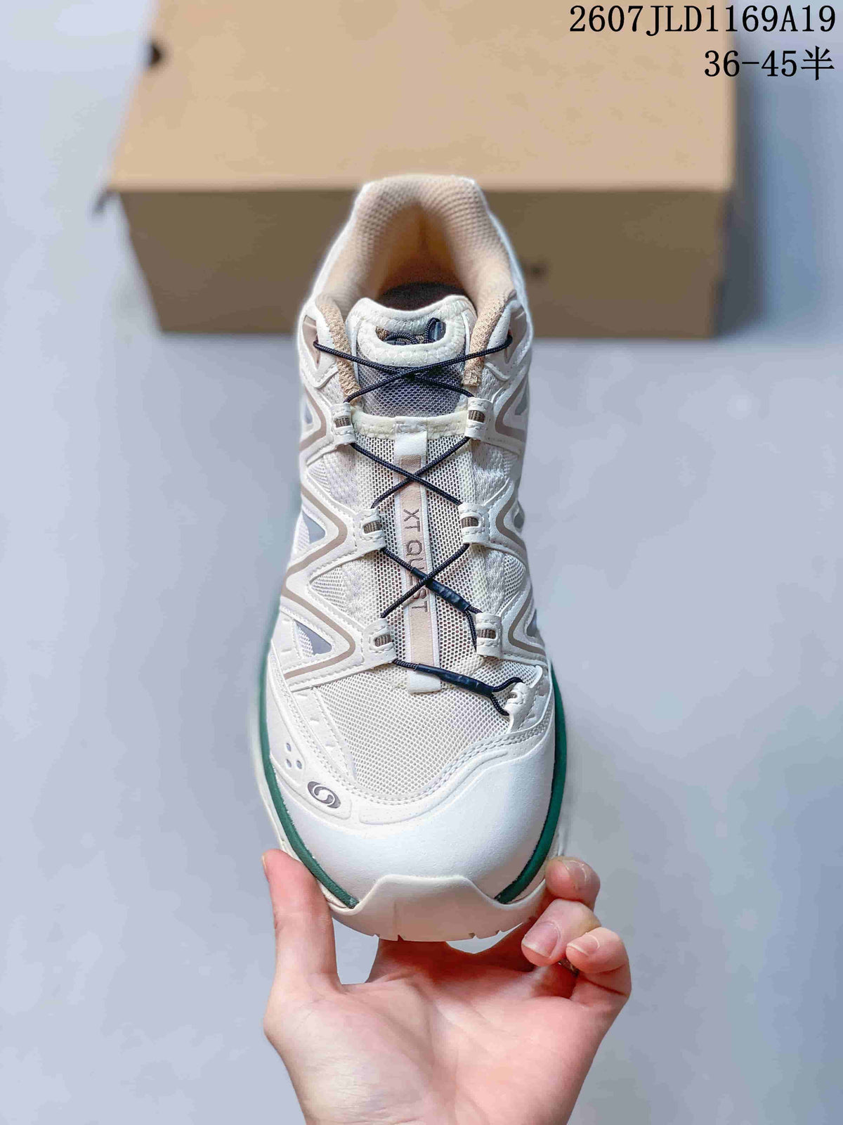 Top view of a white Salomon XT-Quest sneaker showing the layered upper and cord-style lacing system.